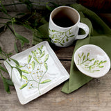 Square stoneware plate with green mistletoe design, additional view