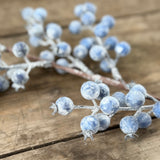 Close-up of frosted pale blue artificial berries