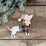 Standing felt dog decoration in a tartan jacket and Christmas hat