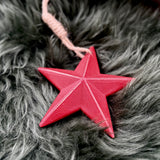 Red wooden star decoration with jute hanging loop