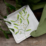 Square stoneware plate with green mistletoe design, additional view