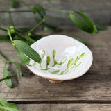 Mini stoneware bowl with green mistletoe design, additional view