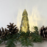 Small tree-shaped LED light in green glass