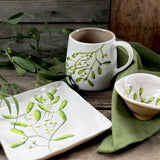 Square stoneware plate with green mistletoe design, additional view