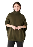 Model wearing the olive mini cable roll neck jumper, side view