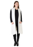 Model wearing the winter white doubleknit roll collar gilet with black top and trousers