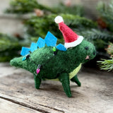 Dark green felt stegosaurus with blue spikes and Santa hat