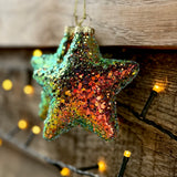 Close-up of the multi-coloured sparkly star tree decoration