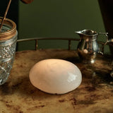 Soft White LED pebble light on a tray with glassware