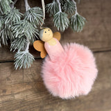 Close-up of a pink pompom angel decoration
