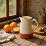 White and terracotta ribbed ceramic jug