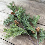 Artificial fir branch with small pine cones