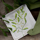 Square stoneware plate with green mistletoe design