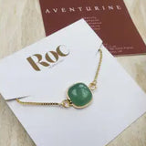 Green Aventurine slider bracelet on ROC display card with Aventurine meaning card